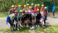 Residents getting ready to participating in a ropes course in 2023